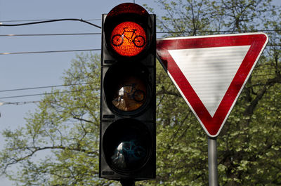 Low angle view of road signal in city