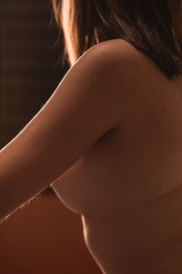 Side view of young woman with arms hair