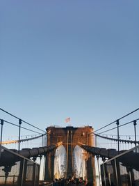 Low angle view of flag against blue sky