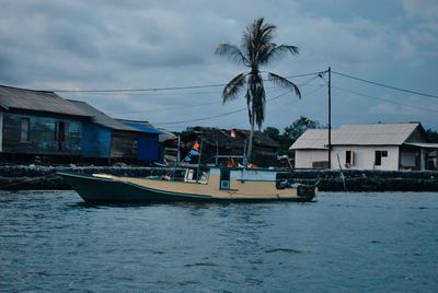 View of sea and houses against sky