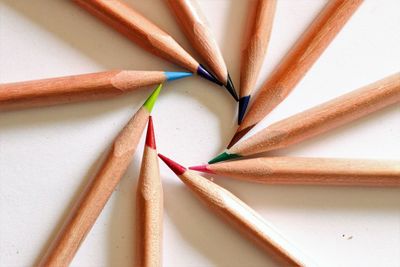 Close-up of multi colored pencils on table