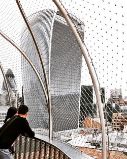 Rear view of man looking at city