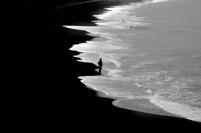 Silhouette of person on beach