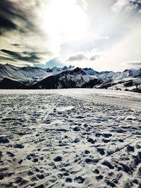 Scenic view of snowcapped mountains against sky