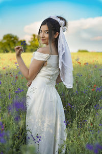 Young woman standing on field