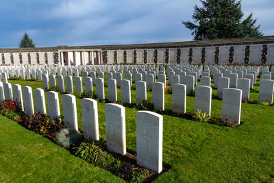 Row of cemetery against sky