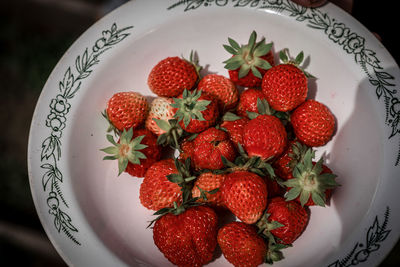 High angle view of strawberries in bowl on table