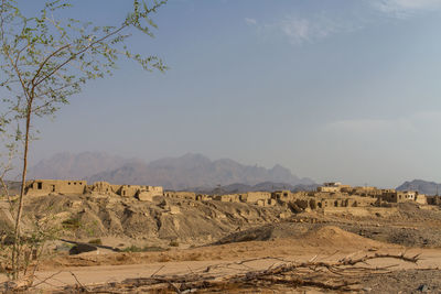 Scenic view of arid landscape against sky