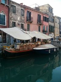 Boats moored in canal