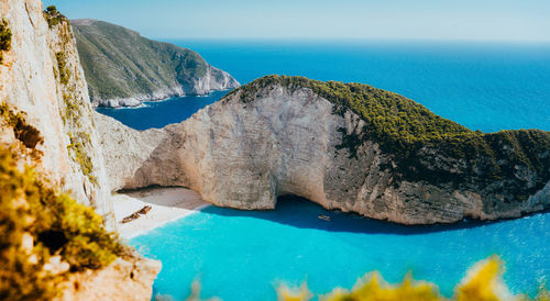 Panoramic view of sea and rocks against sky