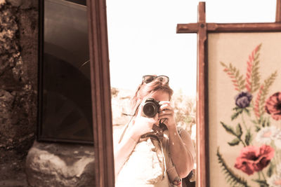 Portrait of man photographing