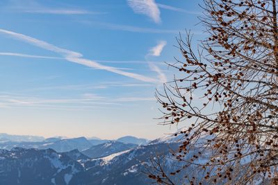 Low angle view of snowcapped mountains against sky