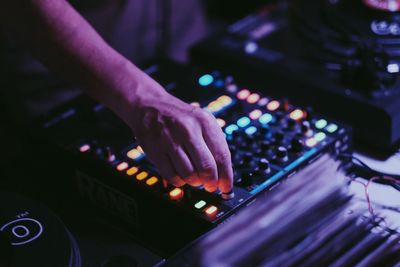 Close-up of hand holding illuminated lighting equipment