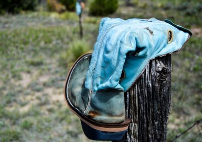 Boot on fence  post