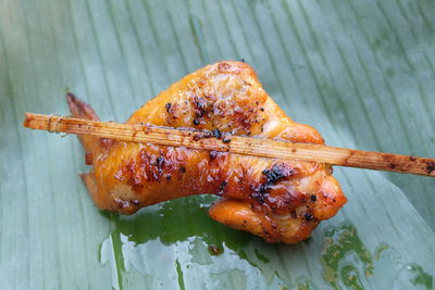 High angle view of meat on barbecue grill