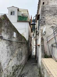 Alley amidst buildings in city