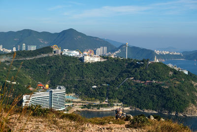 High angle view of hong kong ocean park by sea against sky