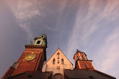 Low angle view of wawel cathedral against sky during sunset