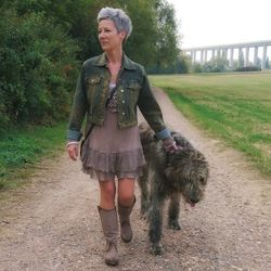 Full length of woman with dog