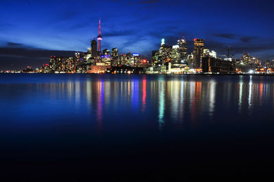 Illuminated buildings in city at night