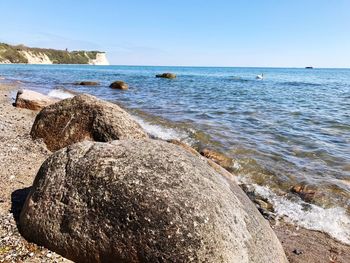 Scenic view of sea against clear blue sky