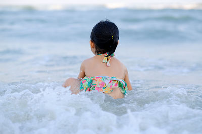 Rear view of woman on beach