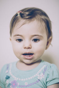 Portrait of cute baby girl at home