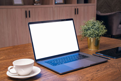 Close-up of laptop on table