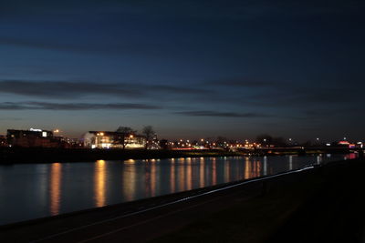 Illuminated city at waterfront