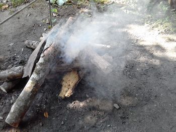 High angle view of smoke emitting from wood