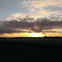 Scenic view of landscape at sunset