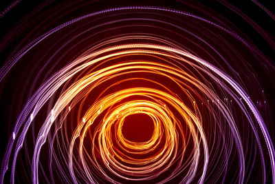 A beautiful, bright light swirl of colors. futuristic light painting on a black background. 