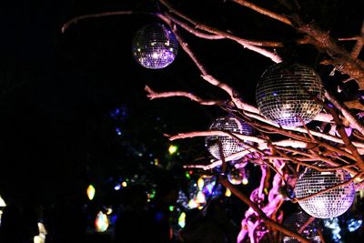 Low angle view of illuminated christmas tree at night