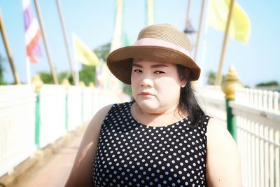 Portrait of beautiful young woman wearing hat