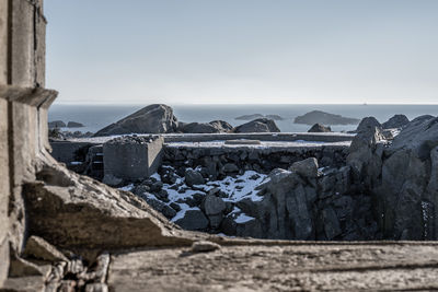 Scenic view of land against clear sky during winter