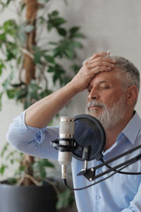 Side view of man working at clinic