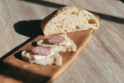 High angle view of bread on cutting board