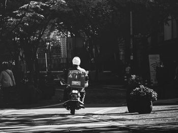 Rear view of man walking on street