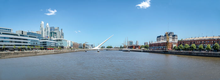 Bridge over river against sky at night