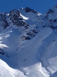 Aerial view of snowcapped mountains against sky
