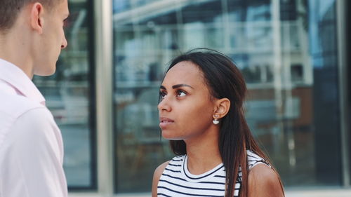 Portrait of a young woman looking away