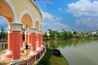 Panoramic view of lake by buildings against sky