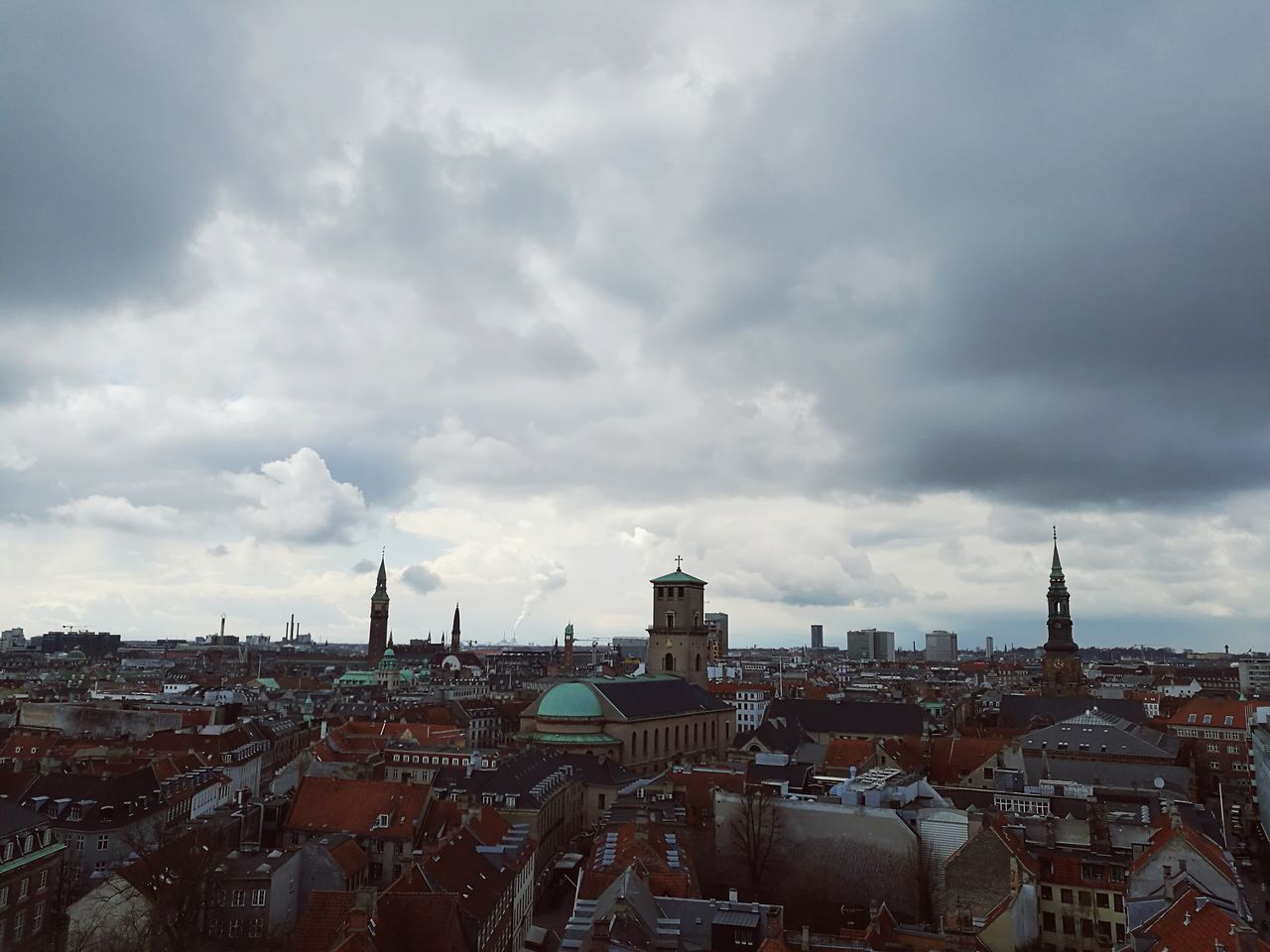 building exterior, architecture, built structure, cityscape, city, sky, crowded, cloud - sky, cloudy, high angle view, residential district, city life, residential building, residential structure, tower, cloud, weather, capital cities, travel destinations, outdoors