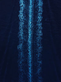 Abstract aerial view of a boat wake pattern