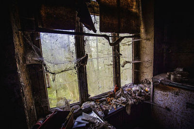 Damaged window in abandoned building
