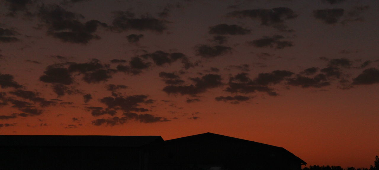 LOW ANGLE VIEW OF SILHOUETTE BUILDING AGAINST SKY AT SUNSET