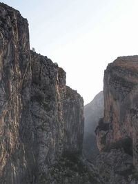 Scenic view of cliff against clear sky