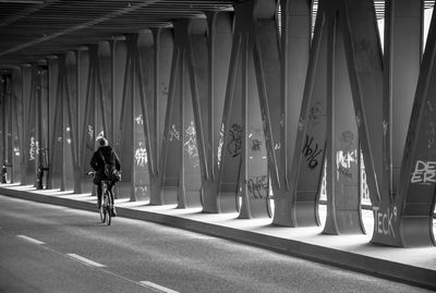 Woman cycling in the tunnel