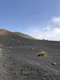 Scenic view of arid landscape against sky