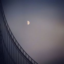 Low angle view of moon against clear sky at night